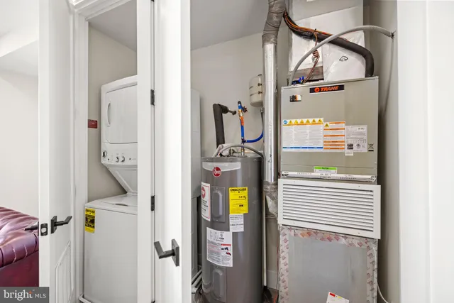 a kitchen with stainless steel appliances granite countertop a sink and a stove
