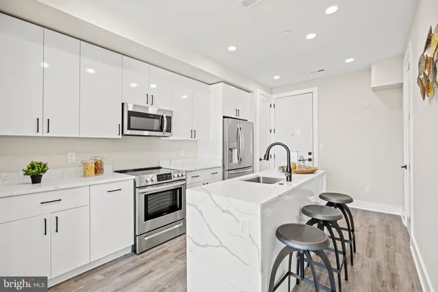 a bathroom with a sink and mirror