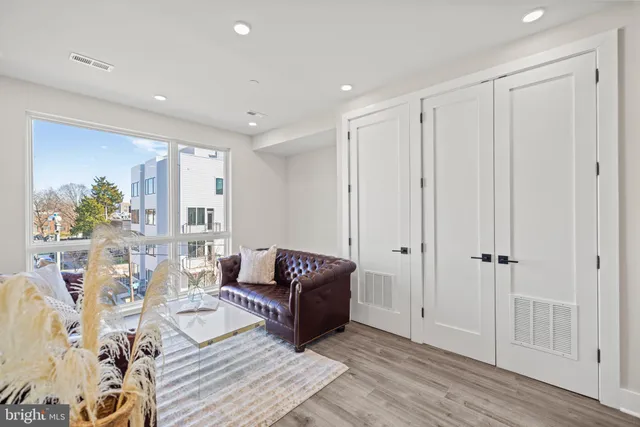 a bathroom with a sink toilet vanity and shower