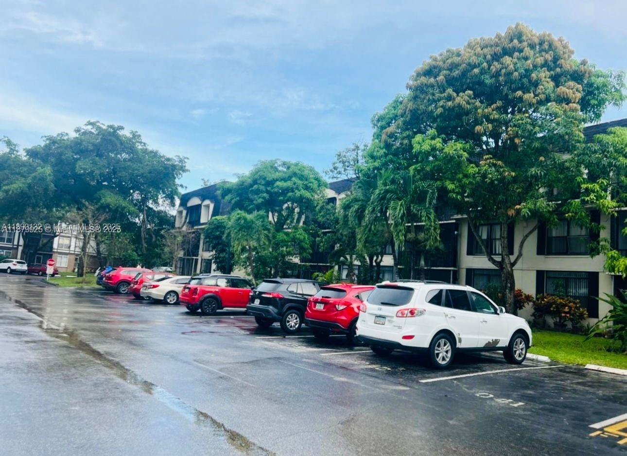 3680 Inverrary Drive, Unit 3O Lauderhill, FL 33319 - Photo 2 of 2 a view of cars parked in front of a house