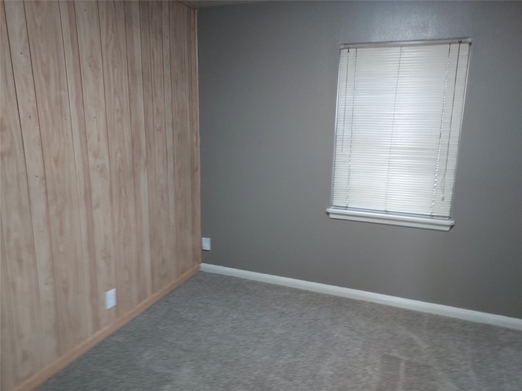 1008 Meadowlane Street Angleton, TX 77515 - Photo 6 of 15 a view of an empty room with a window