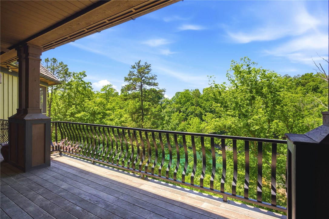 130 River Ridge Road Sunset, SC 29685 - Photo 24 of 47 This spacious deck offers a tranquil vista of vibrant green trees and a serene body of water.