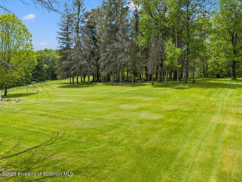 71 Pleasant Avenue Thompson, PA 18465 - Photo 35 of 37 a view of a green yard