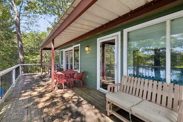 a view of a patio with a table chairs and balcony