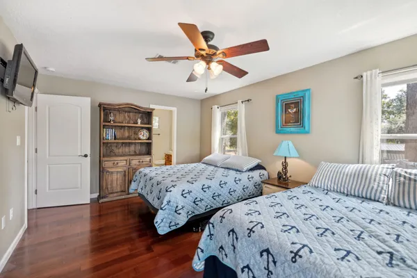 a bathroom with a sink toilet and mirror