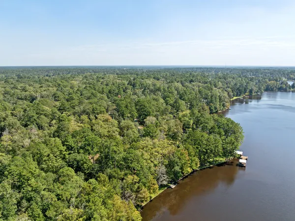 an aerial view of a houses with a yard