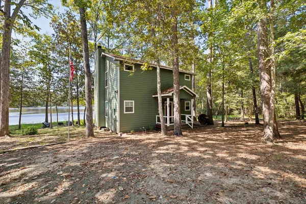a view of outdoor space with deck and tree