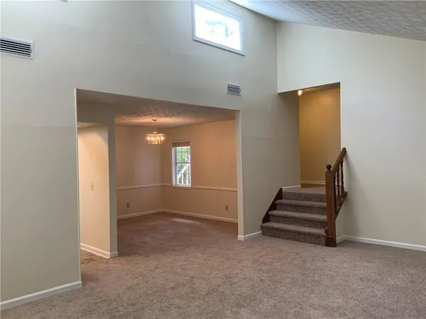 a view of entryway and hall with a window
