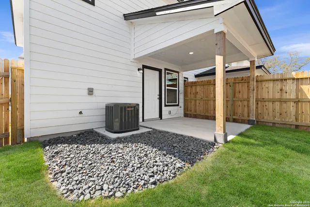 a view of a back yard of the house