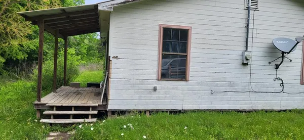 a backyard of a house with lots of green space