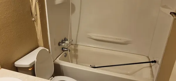 a bathroom with a toilet and a sink