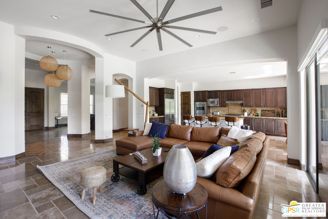 49880 Rancho San Felipe La Quinta, CA 92253 - Photo 12 of 47 a living room with furniture kitchen view and a wooden floor