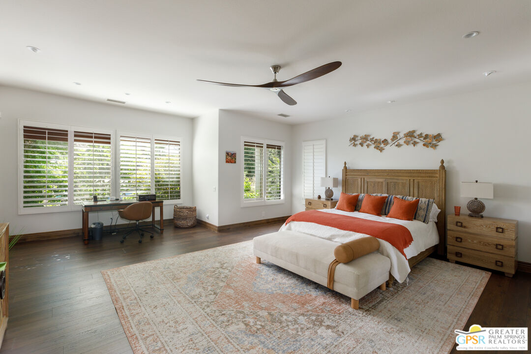 49880 Rancho San Felipe La Quinta, CA 92253 - Photo 14 of 47 a bedroom with a bed couch and a window