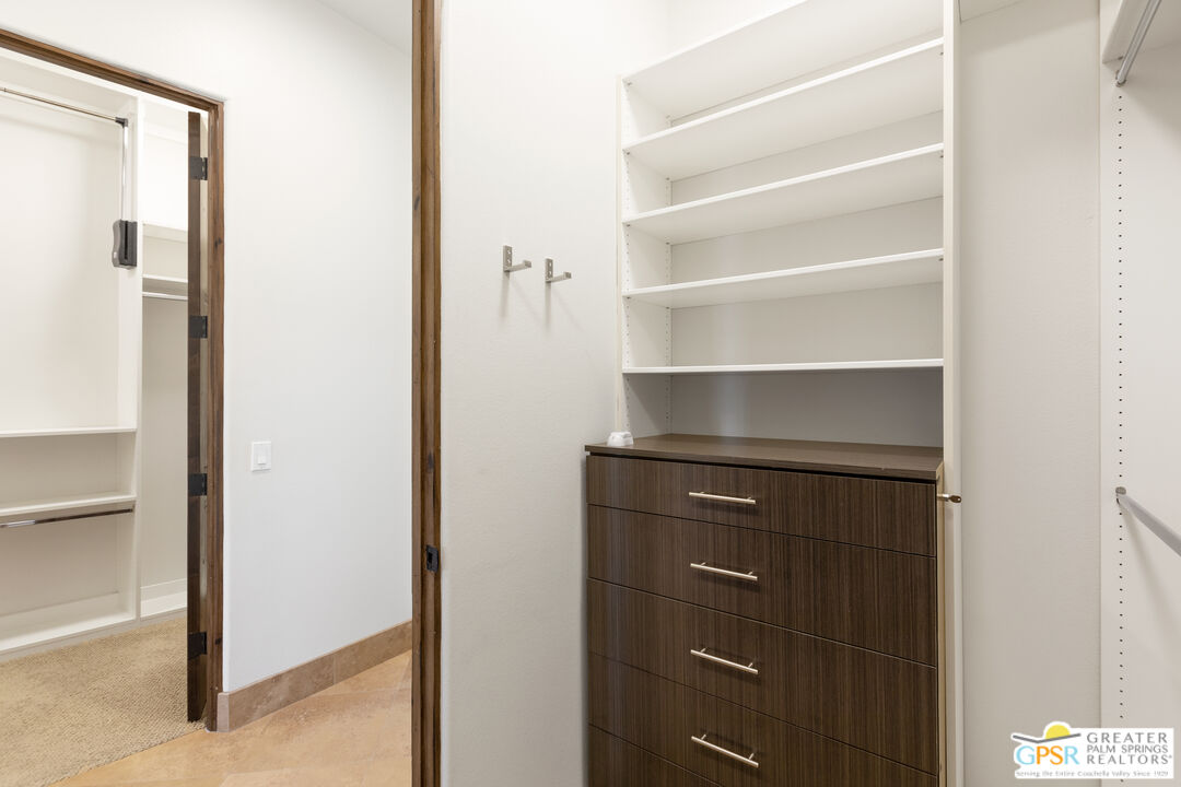 49880 Rancho San Felipe La Quinta, CA 92253 - Photo 16 of 47 a view of walk in closet with empty racks