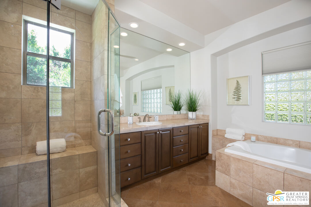 49880 Rancho San Felipe La Quinta, CA 92253 - Photo 18 of 47 a bathroom with a granite countertop tub sink shower and mirror
