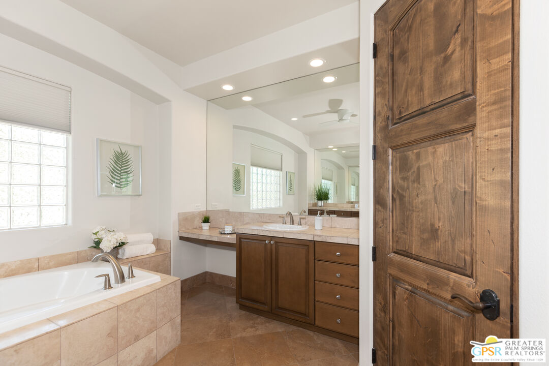 49880 Rancho San Felipe La Quinta, CA 92253 - Photo 19 of 47 a bathroom with a tub sink and mirror