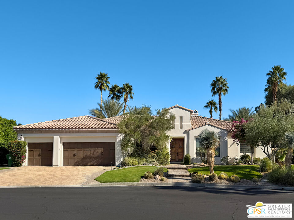 49880 Rancho San Felipe La Quinta, CA 92253 - Photo 2 of 47 a front view of a house with a garden