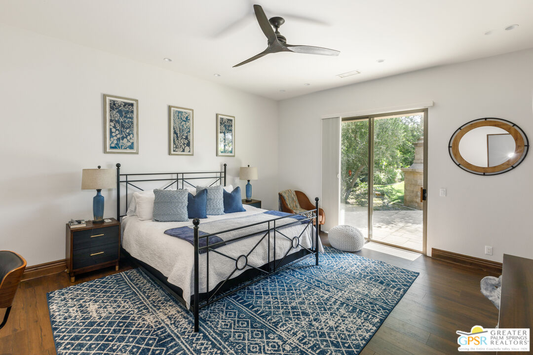 49880 Rancho San Felipe La Quinta, CA 92253 - Photo 21 of 47 a bedroom with a bed lamp and window