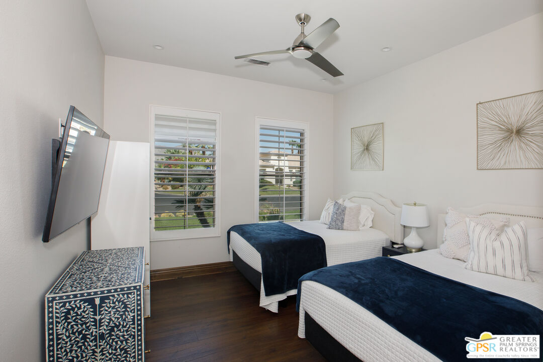49880 Rancho San Felipe La Quinta, CA 92253 - Photo 24 of 47 a bedroom with a bed and a flat screen tv