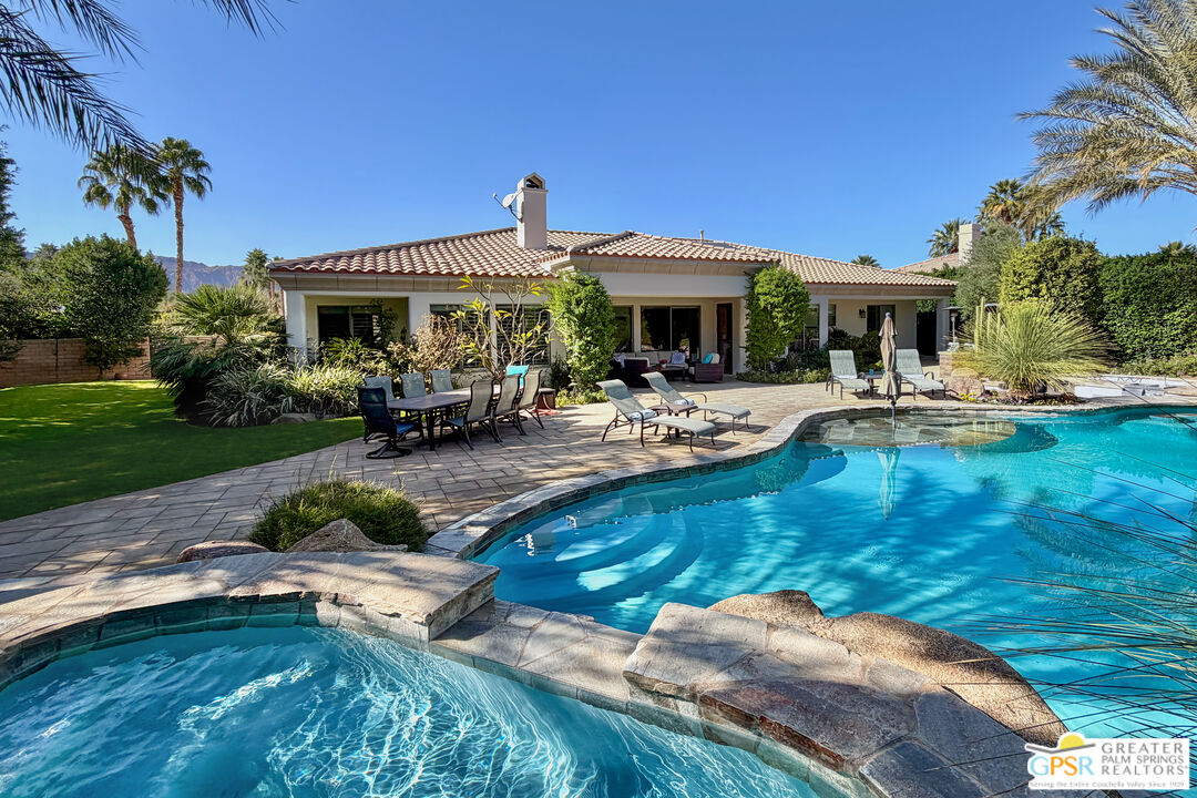 49880 Rancho San Felipe La Quinta, CA 92253 - Photo 3 of 47 a view of a house with swimming pool and a yard