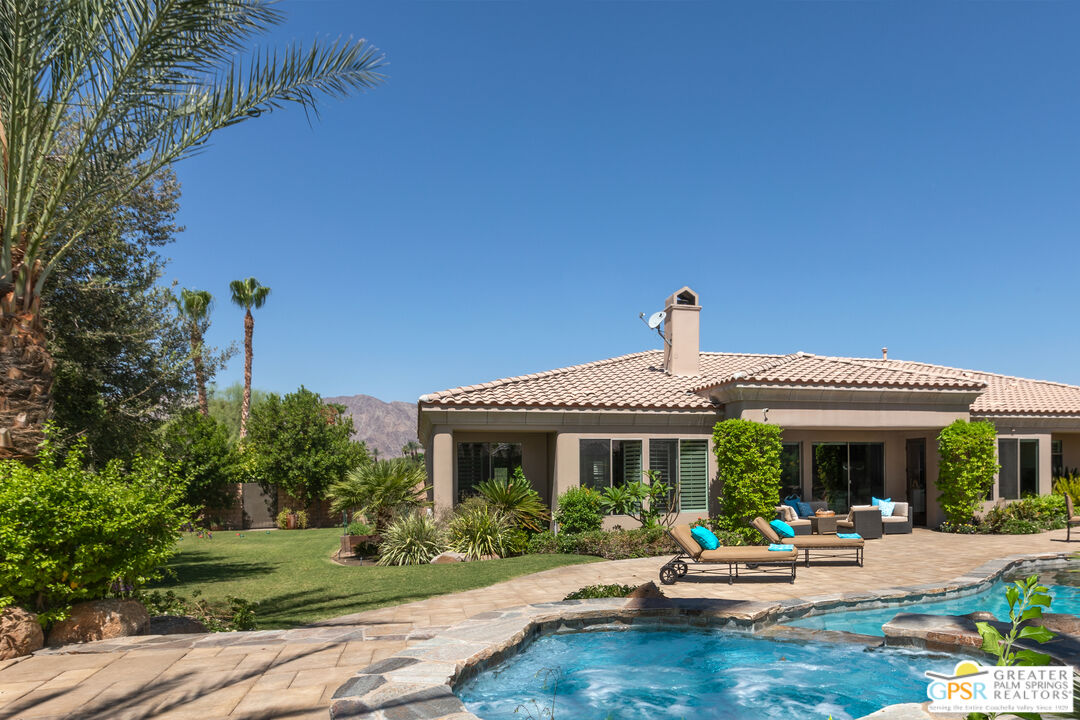 49880 Rancho San Felipe La Quinta, CA 92253 - Photo 31 of 47 a front view of a house with garden