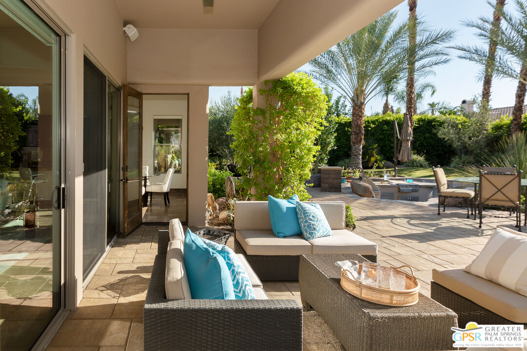 49880 Rancho San Felipe La Quinta, CA 92253 - Photo 32 of 47 a view of a patio with couches chairs dining table and chairs