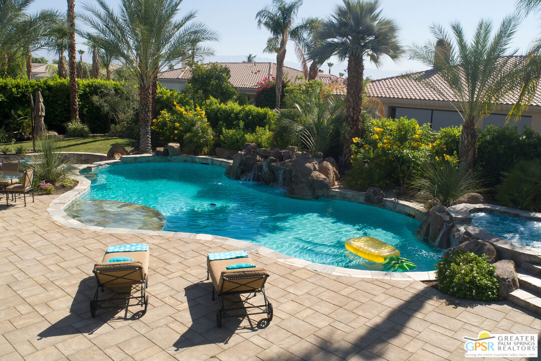 49880 Rancho San Felipe La Quinta, CA 92253 - Photo 35 of 47 a view of a backyard with plants and palm tree