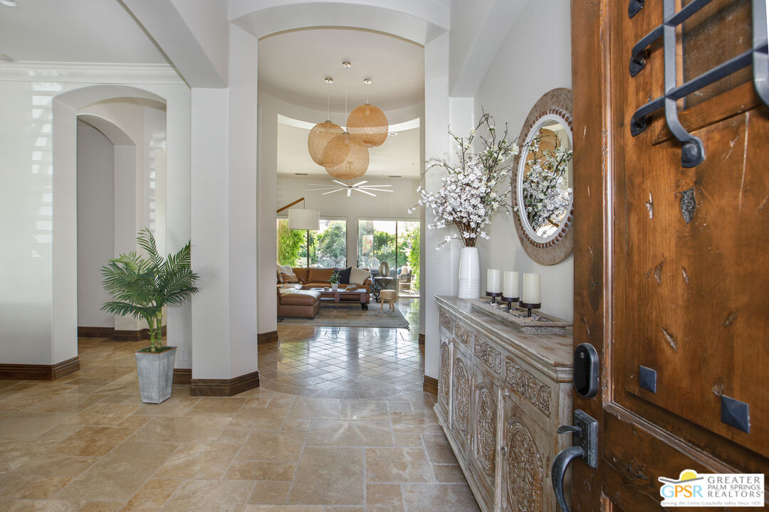 49880 Rancho San Felipe La Quinta, CA 92253 - Photo 4 of 47 a view of a entryway door kitchen and dining room