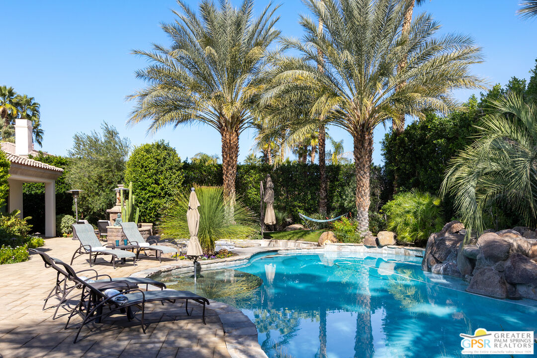 49880 Rancho San Felipe La Quinta, CA 92253 - Photo 44 of 47 a view of a swimming pool with a table and chairs