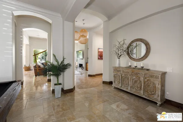 a very nice looking room with a large window and a fireplace