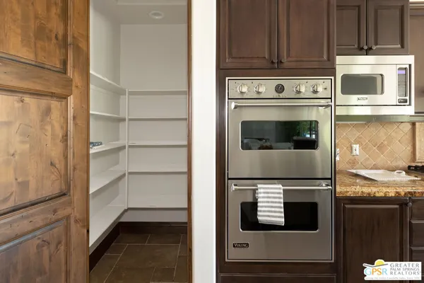 a kitchen with a stove and a microwave