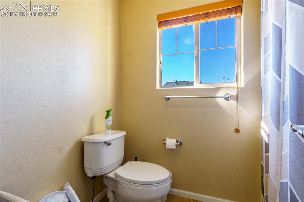 7332 Sandy Springs Point Fountain, CO 80817 - Photo 16 of 28 a white toilet sitting next to a window