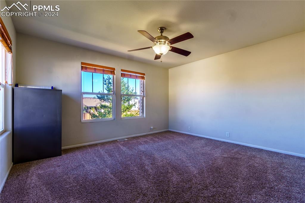 7332 Sandy Springs Point Fountain, CO 80817 - Photo 18 of 28 a view of an empty room with a window
