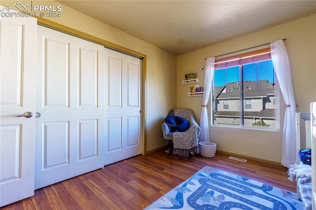 7332 Sandy Springs Point Fountain, CO 80817 - Photo 24 of 28 a view of a livingroom with wooden floor and furniture