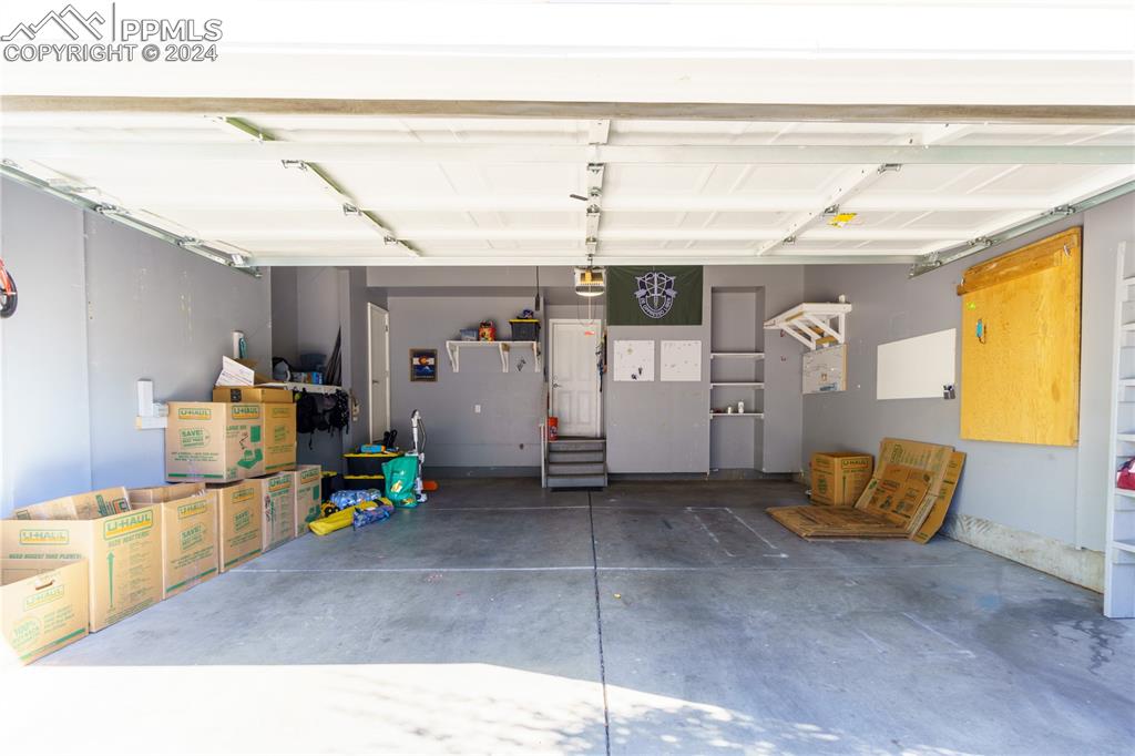 7332 Sandy Springs Point Fountain, CO 80817 - Photo 28 of 28 a living room with furniture and a flat screen tv