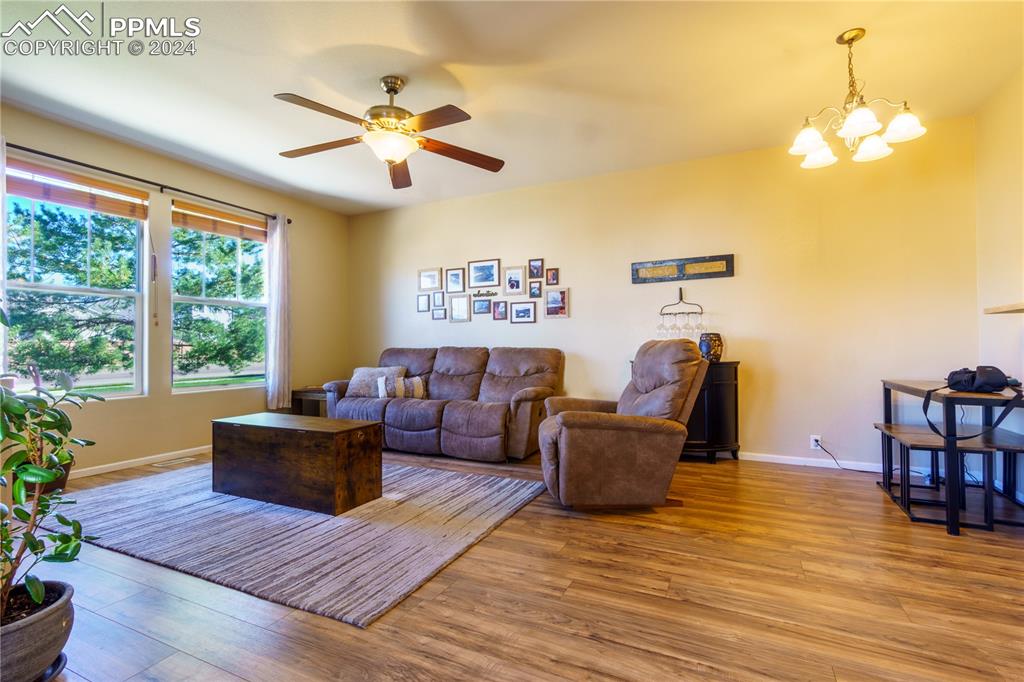 7332 Sandy Springs Point Fountain, CO 80817 - Photo 4 of 28 a living room with furniture and a large window