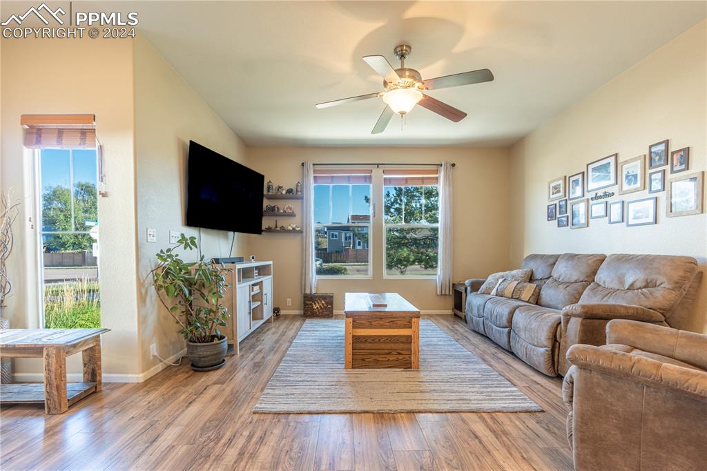 7332 Sandy Springs Point Fountain, CO 80817 - Photo 5 of 28 a living room with furniture and a flat screen tv