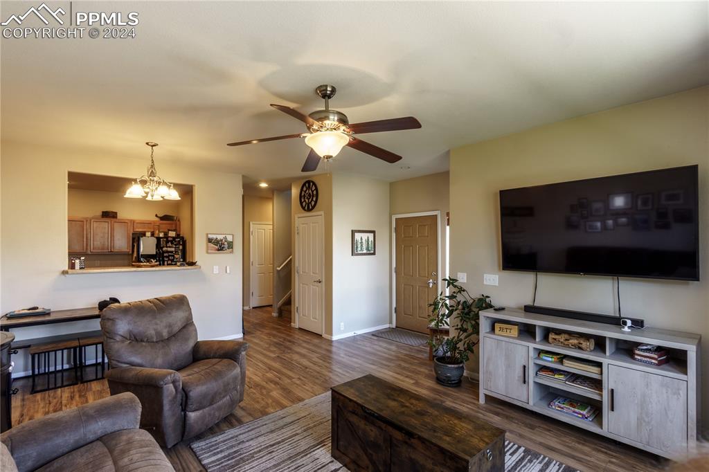 7332 Sandy Springs Point Fountain, CO 80817 - Photo 7 of 28 a living room with furniture and a flat screen tv