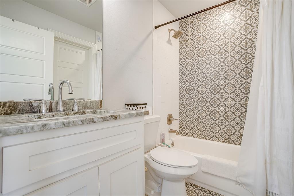 4920 Shining Star Trail Rio Vista, TX 76093 - Photo 22 of 40 a bathroom with a sink toilet and shower