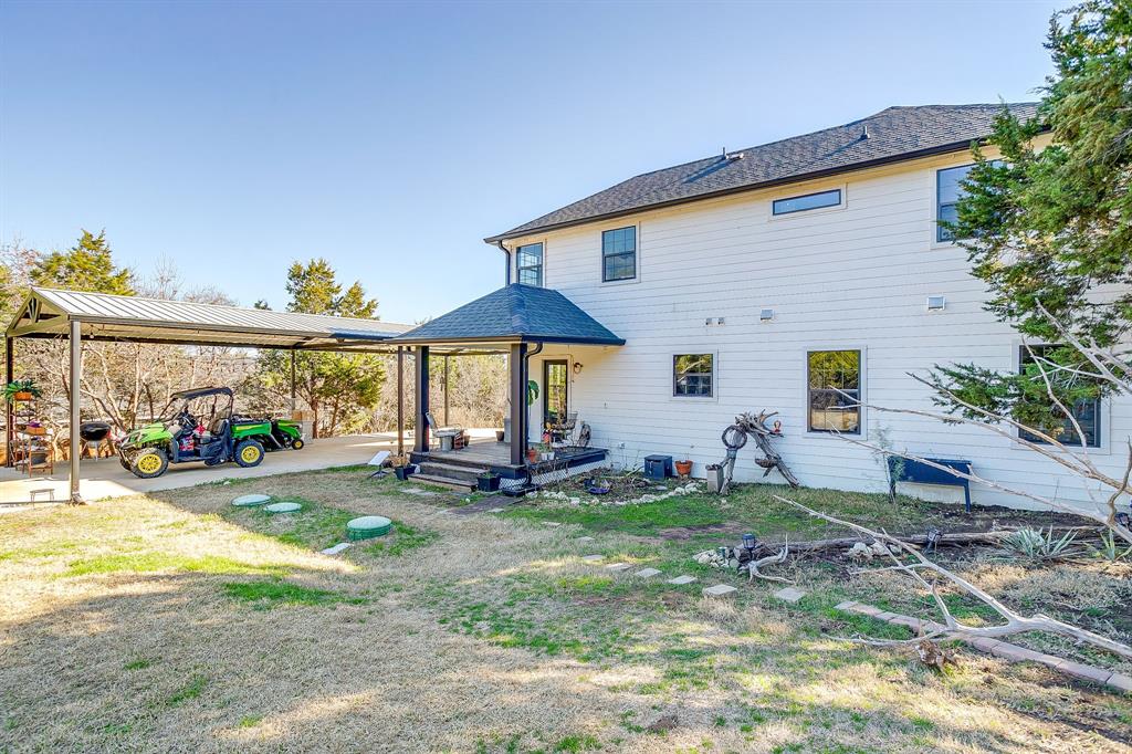 4920 Shining Star Trail Rio Vista, TX 76093 - Photo 35 of 40 a view of a house with backyard and sitting area