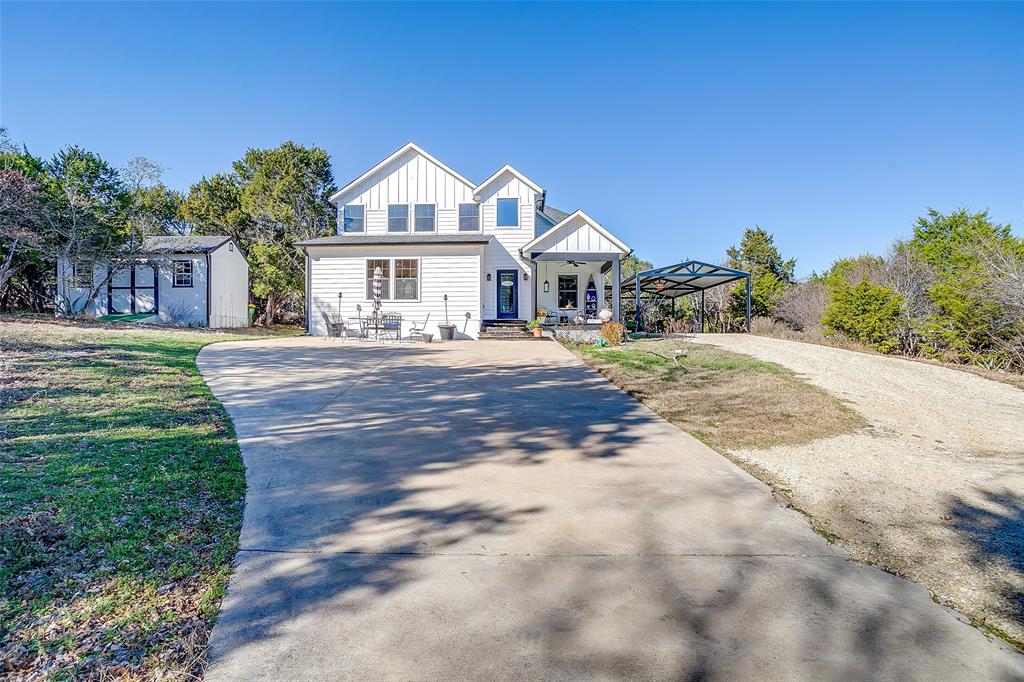 4920 Shining Star Trail Rio Vista, TX 76093 - Photo 4 of 40 a front view of a house with a yard