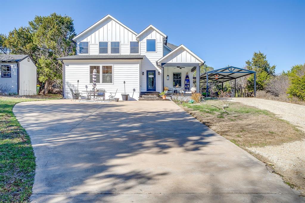 4920 Shining Star Trail Rio Vista, TX 76093 - Photo 5 of 40 a front view of a house with a yard