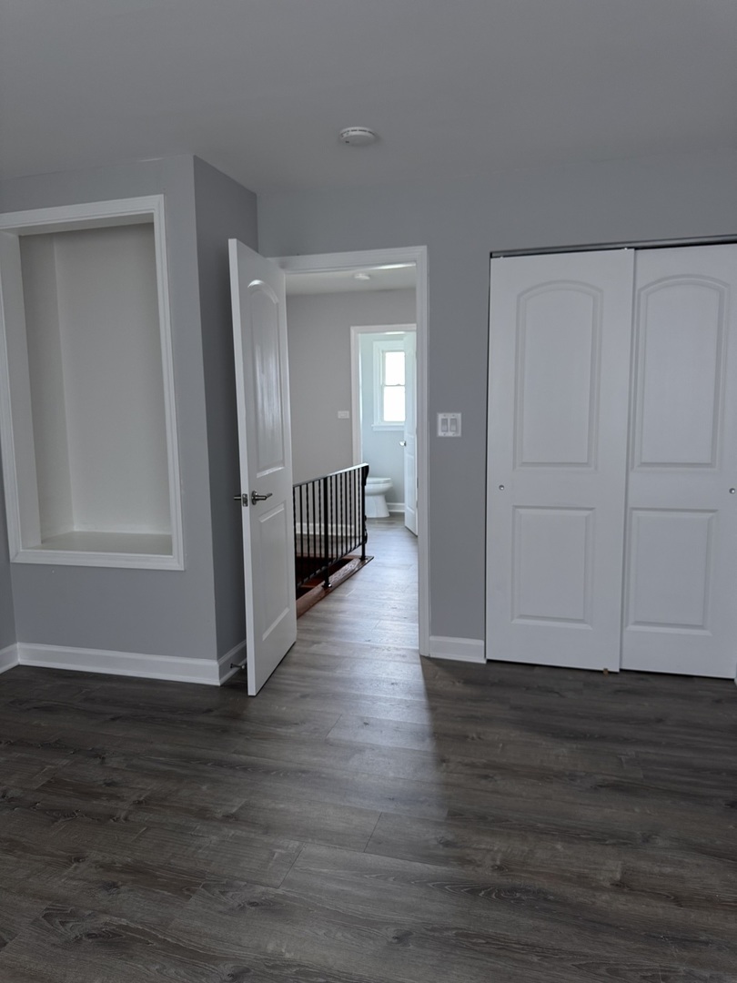 336 Lilac Lane, Unit H Elgin, IL 60123 - Photo 13 of 16 a view of a livingroom with wooden floor