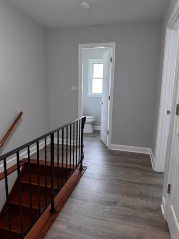 a view of entryway with wooden floor