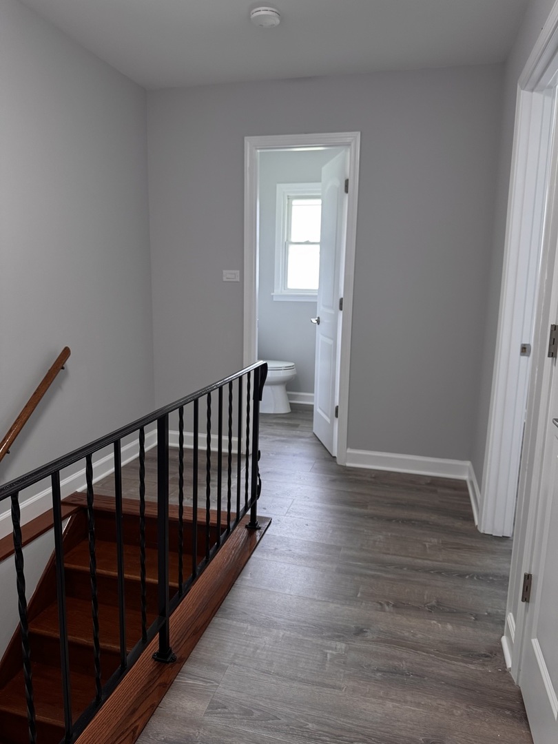336 Lilac Lane, Unit H Elgin, IL 60123 - Photo 15 of 16 a view of entryway with wooden floor