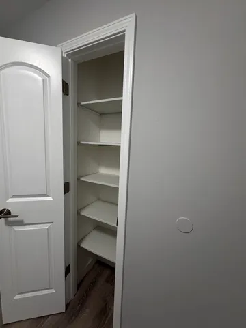 a bathroom with a sink vanity mirror and toilet