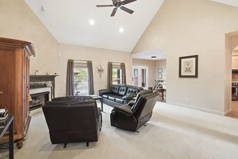 a kitchen with granite countertop white cabinets and stainless steel appliances