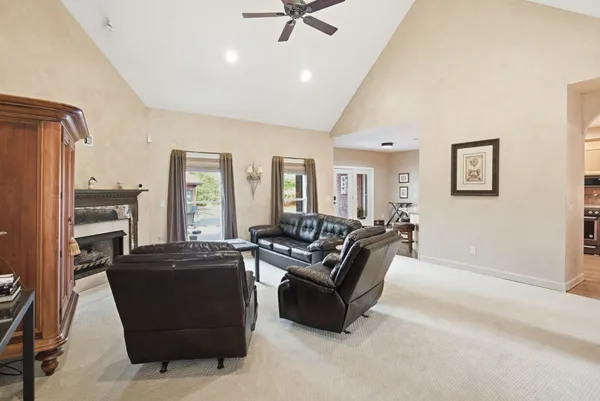 a kitchen with granite countertop white cabinets and stainless steel appliances