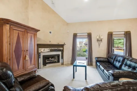 a kitchen with stainless steel appliances granite countertop a refrigerator stove and sink