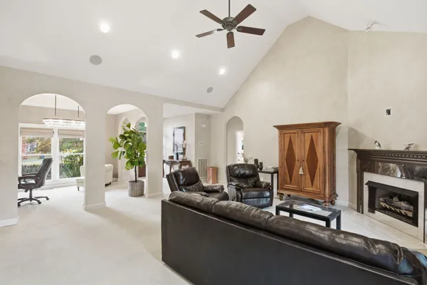 a kitchen with stainless steel appliances a sink cabinets and wooden floor
